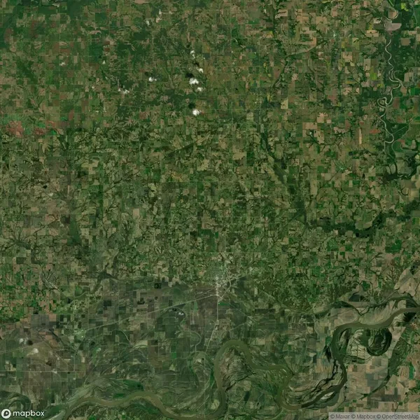 Aerial view of a landscape with patchwork fields, a meandering river, and scattered clouds in a green and brown color palette.