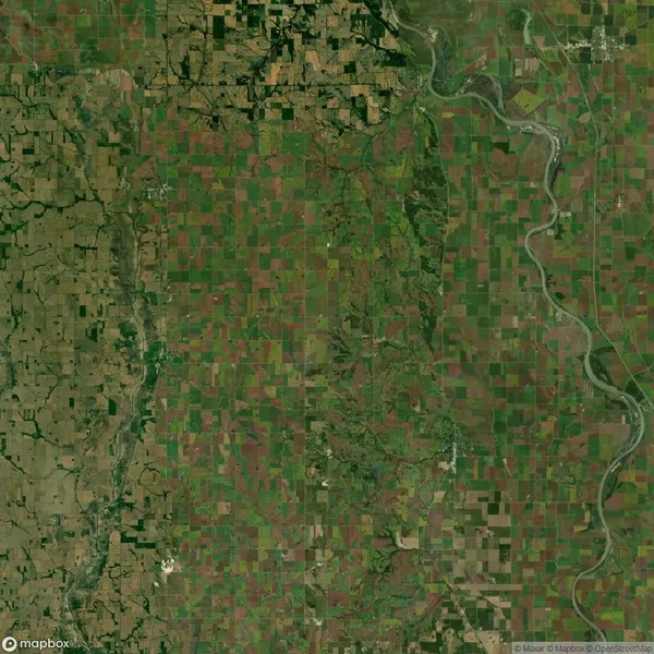 Aerial view of a patchwork of agricultural fields intersected by winding rivers and roads.