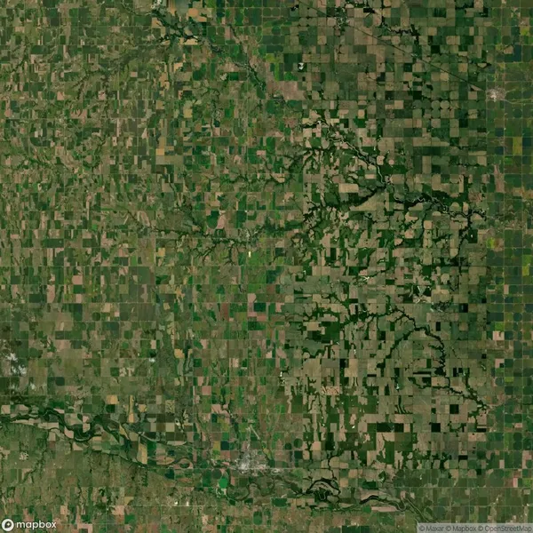 Aerial view of a patchwork of agricultural fields and natural vegetation with rivers traversing the landscape.